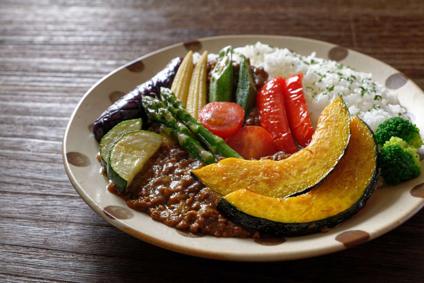 A plate of vegetable curry with rice